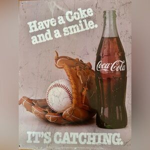 Coca-Cola Bottle with Brown Baseball Glove and White Ball